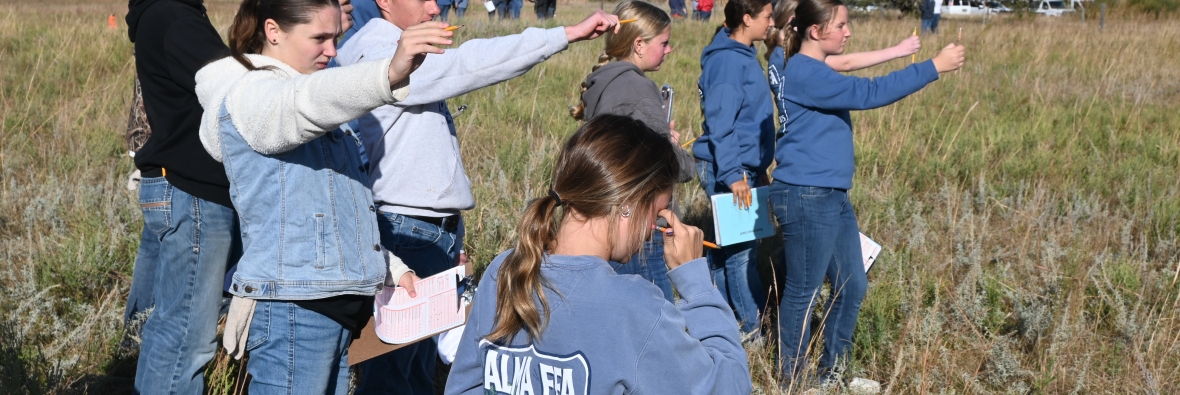 Students determine the slope of land for Land Judging Contest